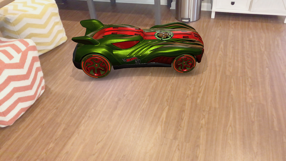 a computer graphics car sits in the middle of a living room